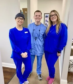 Dr. Connor Denison and dental assistants